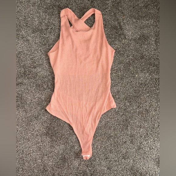 Chic Pink Asymmetrical Bodysuit with Ribbed Texture - Picture 1 of 8